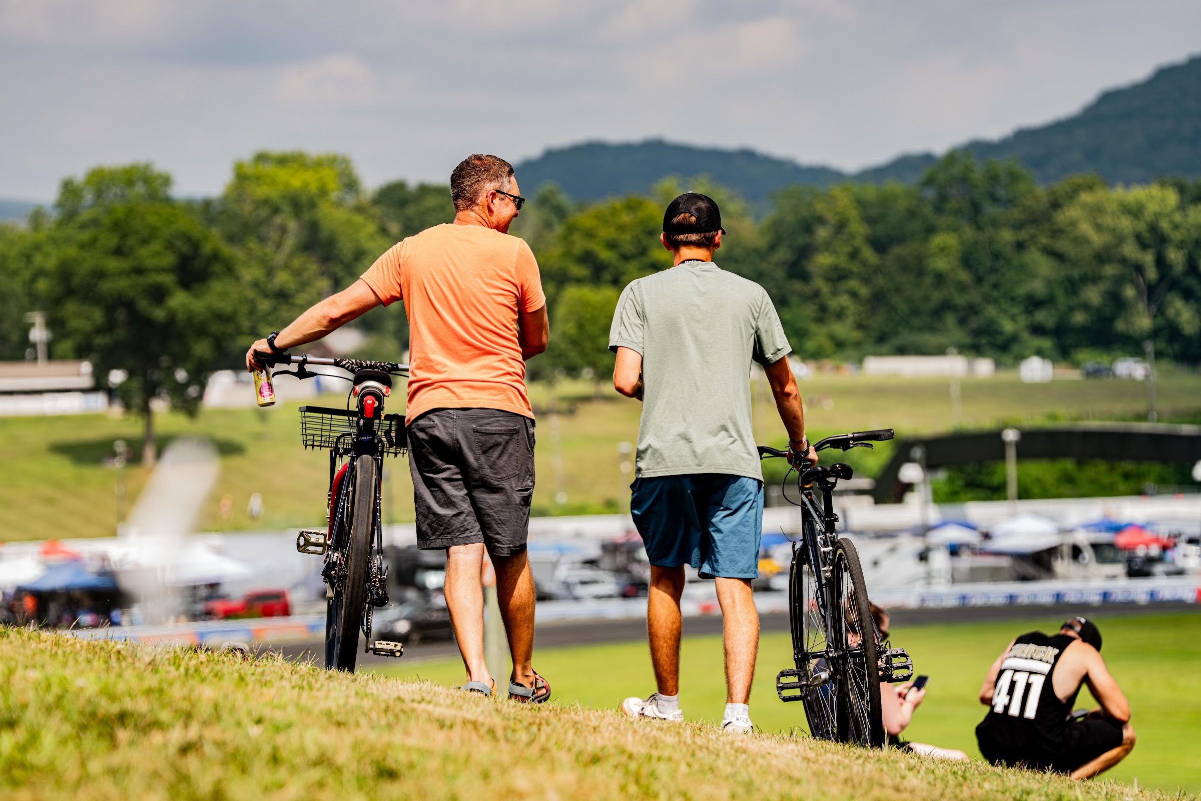 Spectators with bikes taking in the view over the track
