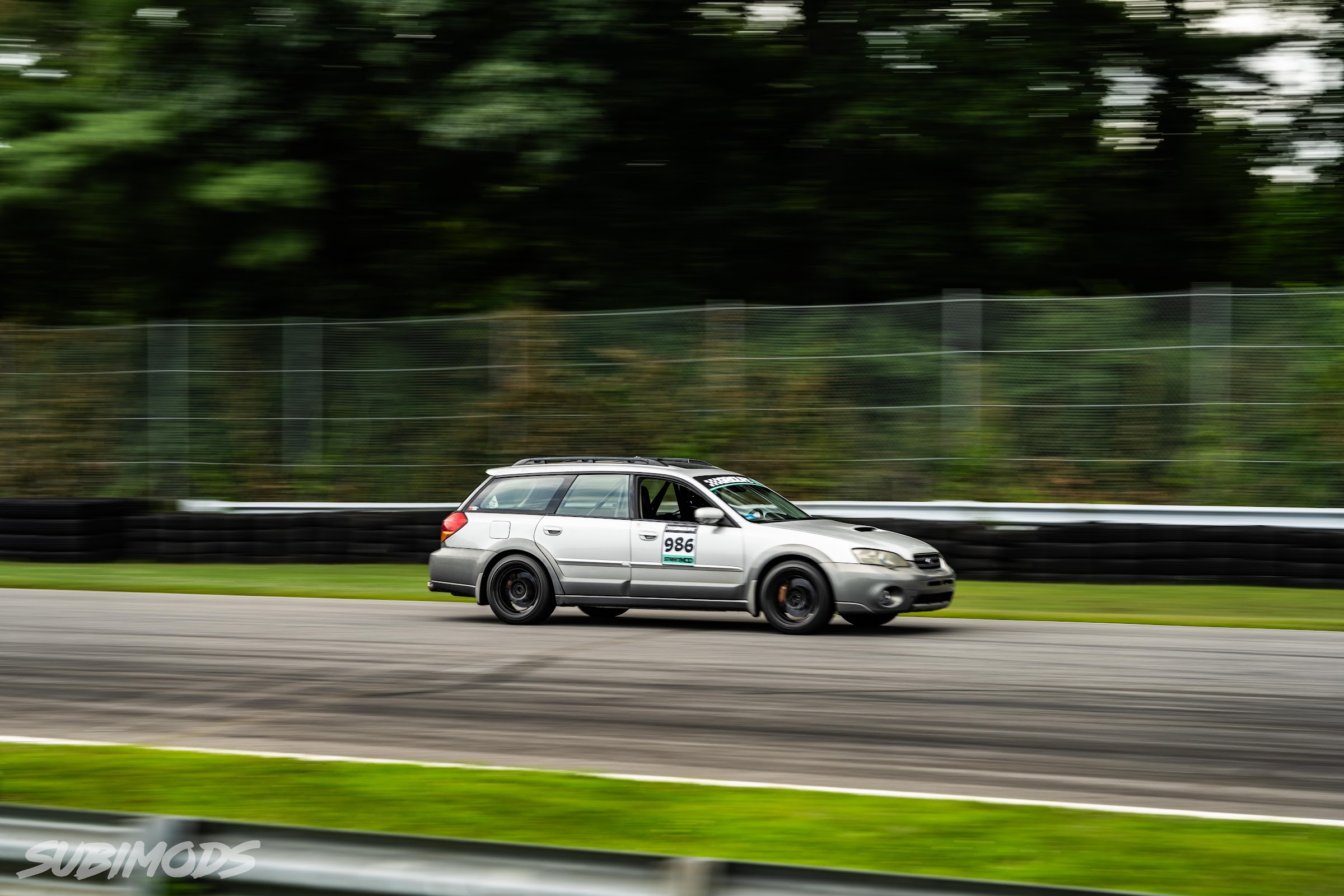 Outback wagon panned tight against the armco